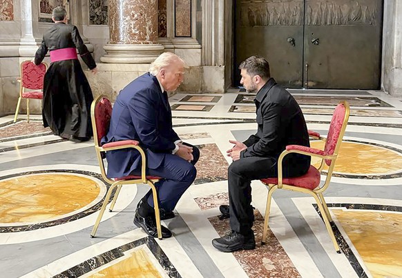 epa12056123 epa12056107 A handout photo made available by the Ukrainian Presidential Press Service shows Ukrainian President Volodymyr Zelensky (R) meeting with US President Donald J. Trump (L) in Sai ...