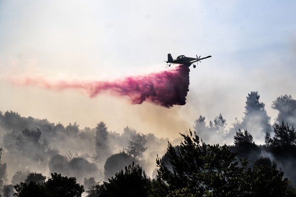 SAFED, ISRAEL - JUNE 12: A plane tries to extinguish a fire that broke out after Hezbollah carried out one of the largest missile attacks on Safed city, northern Israel on June 12, 2024. Hezbollah lau ...