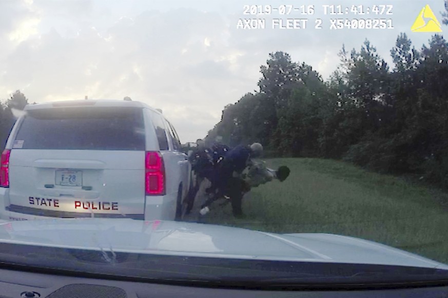 FILE - In this July 16, 2019 image from police dashboard camera video, Louisiana State Trooper Jacob Brown throws motorist Morgan Blake to the ground following a traffic stop in Ouachita Parish, La., ...