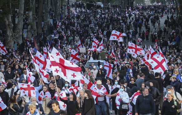 epa12430323 Georgian opposition party supporters attend a rally during local elections in Tbilisi, Georgia, 04 October 2025. Elections to local governments are held in Georgia on 04 October, where mem ...