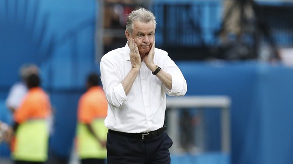 Swiss head coach Ottmar Hitzfeld, left, reacts next to Switzerland&#039;s Stephan Lichtsteiner during the group E preliminary round match between Switzerland and Honduras in the Arena da Amazonia in M ...