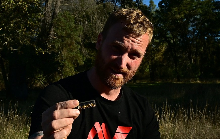 Cody Blanchard of Heritage Gold Rush displays a vial of gold he found in the area using his metal detector to detect gold on October 27, 2025 in El Dorado County, north of Sacramento, California. Blan ...