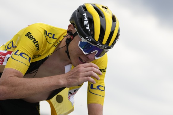 Slovenia&#039;s Tadej Pogacar reacts as he crosses the finish line with a delay to loose his overall leader&#039;s yellow jersey in the eleventh stage of the Tour de France cycling race over 152 kilom ...