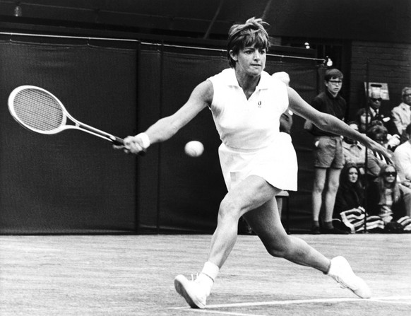 Australian Margaret Court races to return the ball to Billie Jean King during the Wimbledon women&#039;s singles finals on July 3, 1970.