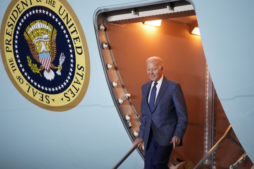 President Joe Biden steps off Air Force One at Belfast International Airport in Belfast, Northern Ireland, Tuesday, April 11, 2023. Biden is visiting the United Kingdom and Ireland in part to help cel ...