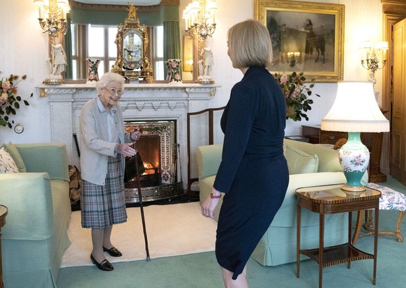 Britain's Queen Elizabeth II, left, welcomes Liz Truss during an audience at Balmoral, Scotland, where she invited the newly elected leader of the Conservative party to become Prime Minister and ...