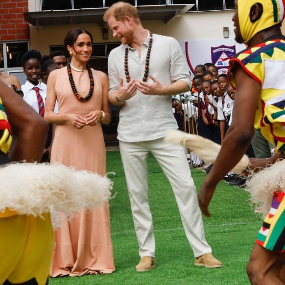 ABUJA, NIGERIA - MAY 10: (EDITORIAL USE ONLY) Prince Harry, Duke of Sussex and Meghan, Duchess of Sussex visit Lightway Academy on May 10, 2024 in Abuja, Nigeria. (Photo by Andre Esiebo/Getty Images f ...