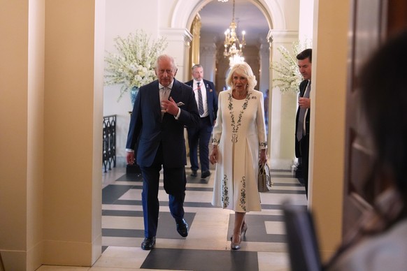 Britain's King Charles III and Queen Camilla enter the Ambassador's Library in the British Embassy, Monday, April 27, 2026, in Washington. (AP Photo/Julia Demaree Nikhinson, Pool)