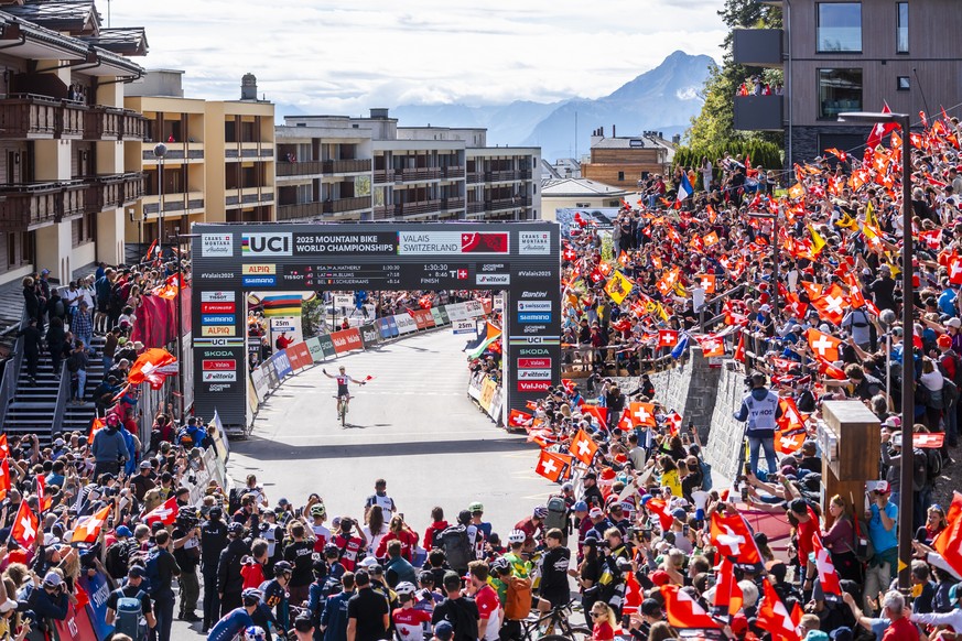 Nino Schurter of Switzerland, cross the finish line of the UCI MTB Elite Men Cross Country, XCO, Mountain Bike World Championship, on Sunday, September 14, 2025, in Crans Montana, Switzerland.(KEYSTON ...