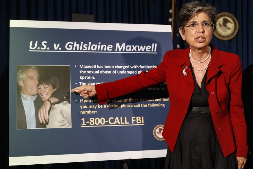 FILE- In this July 2, 2020 file photo, Audrey Strauss, Acting United States Attorney for the Southern District of New York, points to a photo of Jeffrey Epstein and his ex-girlfriend Ghislaine Maxwell ...