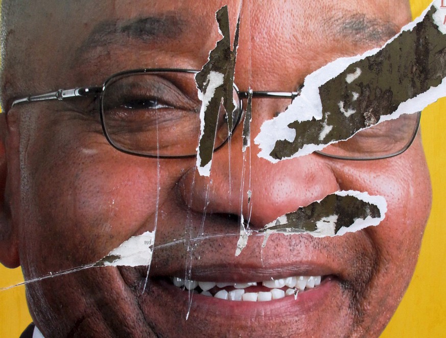 epa09330730 (FILE) - A torn African National Congress (ANC) election poster shows the face of ANC president Jacob Zuma, revealing that not all South African&#039;s want the ANC to remain in power, Sow ...