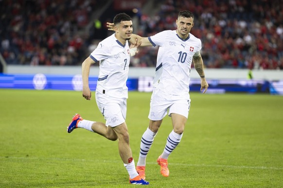 Switzerland&#039;s Zeki Amdouni, left, celebrates with teammate Granit Xhaka after scoring the 2-0 during an international friendly soccer match between Switzerland and Estonia at the Swissporarena in ...