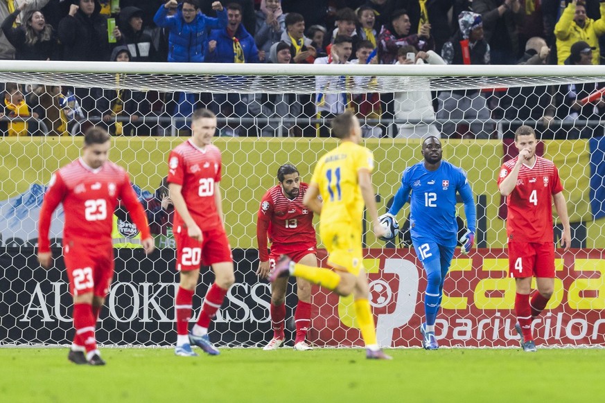 Switzerland&#039;s Xherdan Shaqiri, Michel Aebischer, Ricardo Rodriguez, Yvon Mvogo and Nico Elvedi, from left, after Romania&#039;s first goal during the UEFA Euro 2024 qualifying group I soccer matc ...