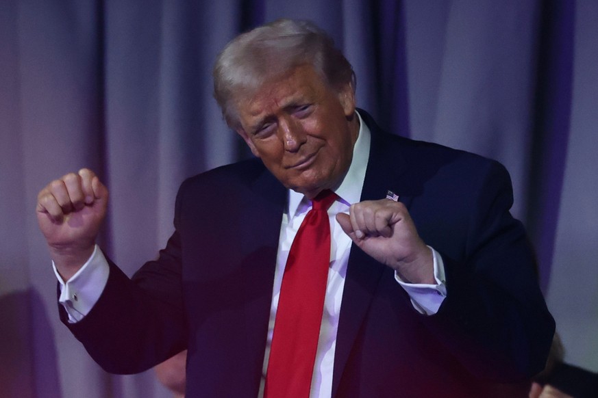 President Donald Trump dances during the draw for the 2026 soccer World Cup at the Kennedy Center in Washington, Friday, Dec. 5, 2025. (Dan Mullan/Pool Photo via AP)
