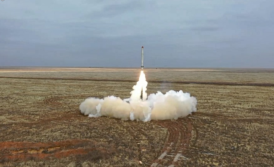 This photo taken from video provided by the Russian Defense Ministry Press Service on Saturday, Feb. 19, 2022, shows a Russian Iskander-K missile launched during a military exercise at a training grou ...