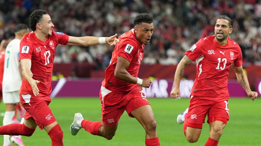 Switzerland's Dan Ndoye (11), center, celebrates with teammates after scoring his side's second goal during the World Cup round of 32 soccer match between Switzerland and Algeria in Vancouve ...
