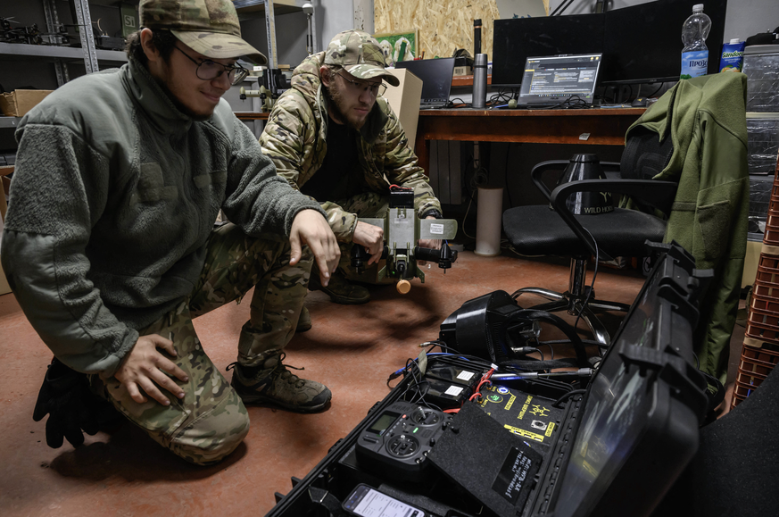 Members of the 3rd Army Corps Interception Squadron check the delivery of a mobile workstation used to control interceptor drones, at an undisclosed location near the front lines of eastern Uraine, on ...