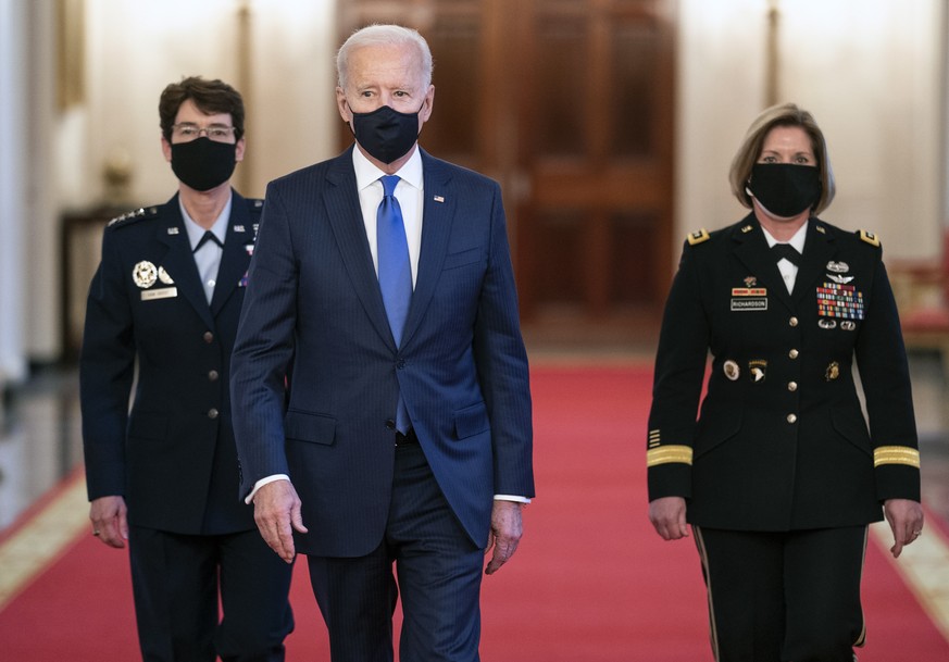 epa09062988 US President Joe Biden (C) walks with his Combatant Commander nominees, Air Force Gen. Jacqueline Van Ovost (L) and Army Lt. Gen. Laura Richardson as they arrives for their nomination anno ...