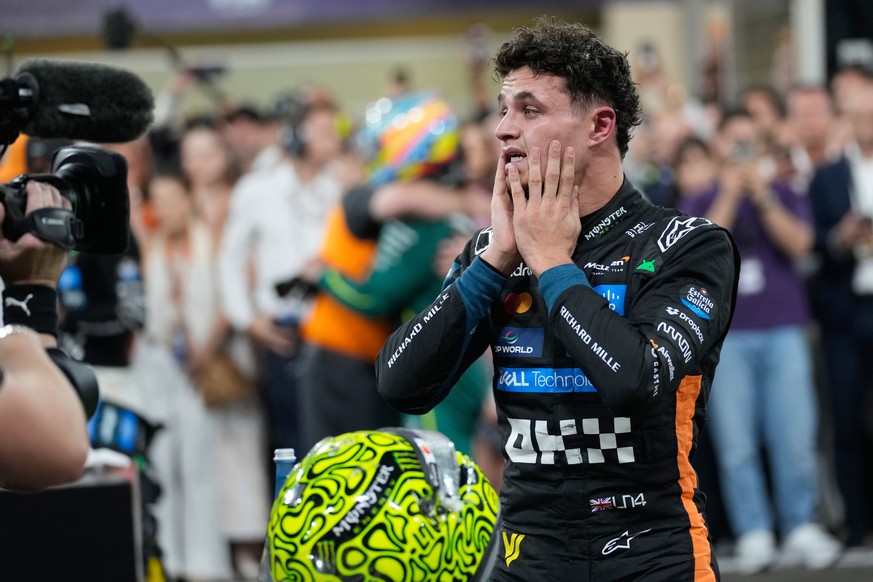 McLaren driver Lando Norris of Britain reacts after becoming a world champion after the Abu Dhabi Formula One Grand Prix in Abu Dhabi, United Arab Emirates, Sunday, Dec. 7, 2025. (AP Photo/Darko Bandi ...