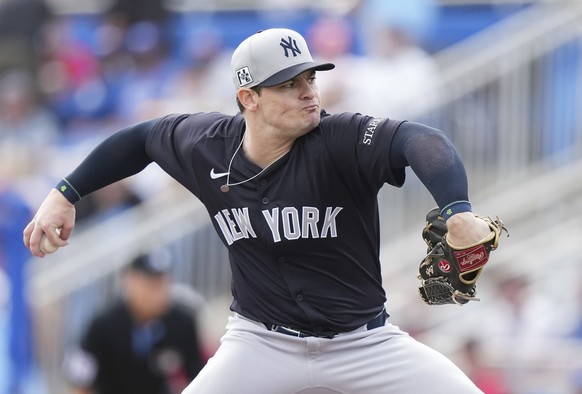 New York Yankees pitcher Harrison Cohen works against the Toronto Blue Jays during the third inning of a spring training baseball game in Dunedin Fla., Saturday, Feb. 22, 2025. (Nathan Denette/The Can ...