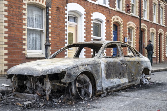 epa13028253 A burnt-out car is seen on McMaster Street following riots in Belfast, Northern Ireland, 10 June 2026. The Police Service of Northern Ireland (PSNI) said there was a night of unrest across ...