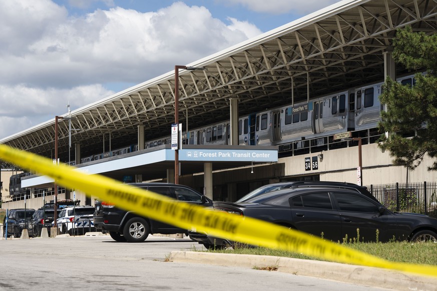 Yellow tape blocks off the parking lot of the Forest Park Blue Line train station in Forest Park, Ill., after four people were fatally shot on the train early Monday, Sept. 2, 2024. (Pat Nabong/Chicag ...