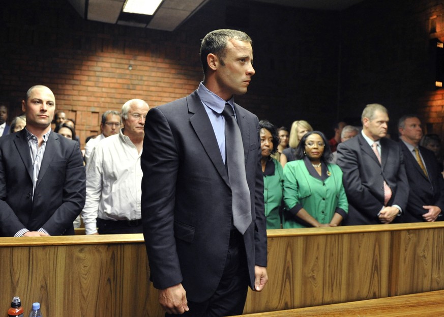 FILE - Olympian Oscar Pistorius stands following his bail hearing in Pretoria, South Africa, Tuesday, Feb. 19, 2013. Pistorius could be granted parole on Friday, Nov. 24, 2023 after nearly 10 years in ...