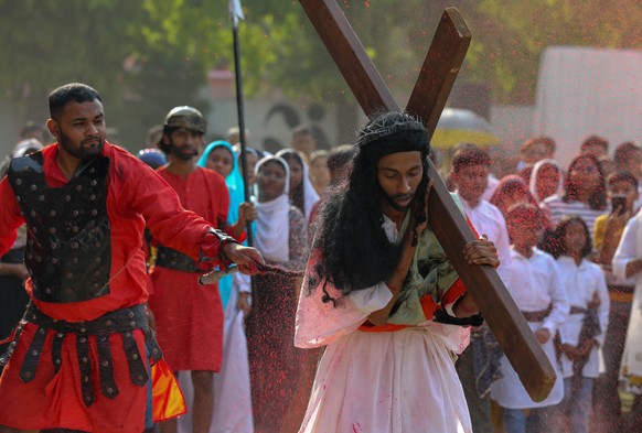 epa12039205 Indian Christians take part in a re-enactment of the Stations of the Cross on Good Friday in New Delhi, India, 18 April 2025. Good Friday is a religious holiday observed by Christians, com ...