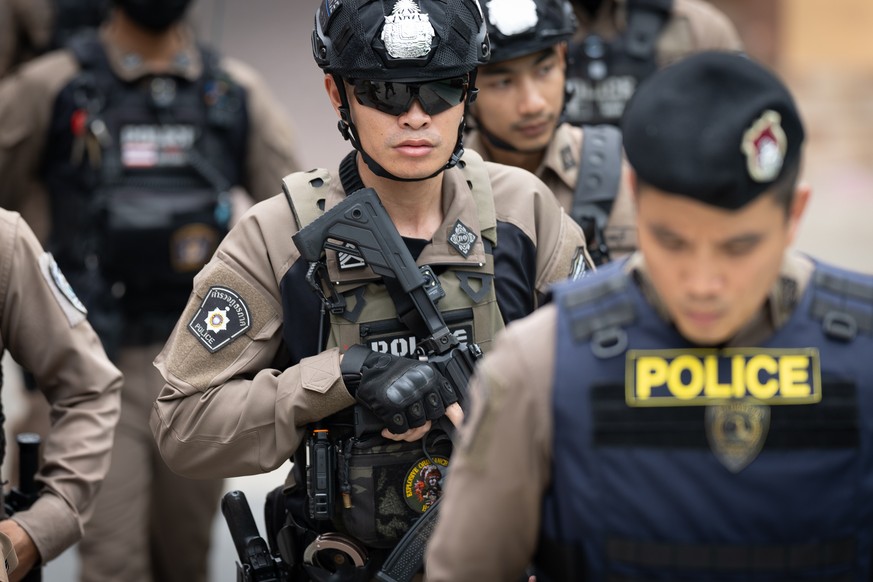 Police officers secure Debsirin Nonthaburi School, where a shooting killed several people in Thailand's Nonthaburi province, Friday, Aug. 7, 2026. (AP Photo/Wason Wanichakorn)
Thailand School Sho ...