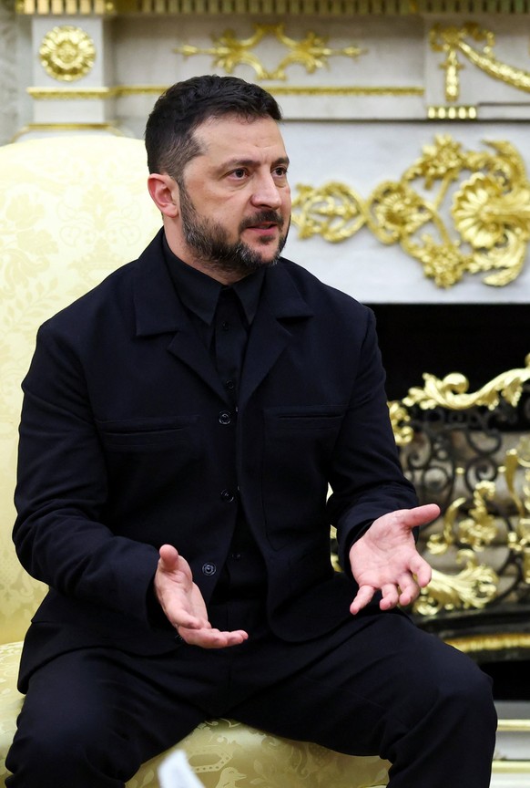 U.S. President Donald Trump gestures as he meets with Ukrainian President Volodymyr Zelenskiy (not pictured) at the White House amid negotiations to end the Russian war in Ukraine, in Washington, D.C. ...