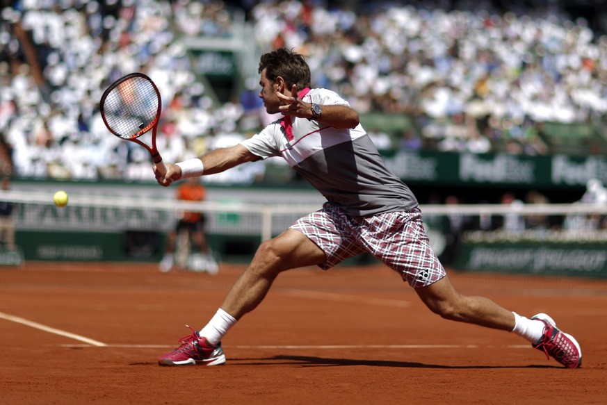 epa04787796 Stan Wawrinka of Switzerland in action against Novak Djokovic of Serbia during the men's final match for the French Open tennis tournament at Roland Garros in Paris, France, 07 June 2 ...