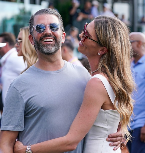 April 6, 2025, Doral, Florida, USA: Bettina Anderson (R) and Donald Trump Jr on the 18th green after the final round of LIV Golf Miami at Trump National Doral. (Credit Image: � Debby Wong/ZUMA Press W ...