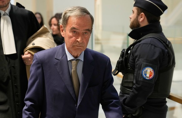 Bruno Lafont, former CEO of Lafarge arrives at court in Paris on Monday, April 13, 2026, for the verdict in a case involving payments of millions to terrorist groups a decade ago to keep the factory o ...