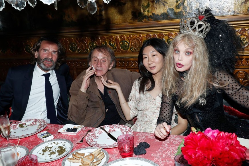 PARIS, FRANCE - JUNE 19: (L-R) Frederic Beigbeder, Michel Houellebecq, his wife Qianyum Lysis Li and Arielle Dombasle attend the Laperouse Mask Ball on the occasion of the inauguration evening of the  ...