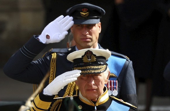 Britain&#039;s King Charles III and Prince William salute as they attend the state funeral and burial of Britain&#039;s Queen Elizabeth, in London, Monday Sept. 19, 2022. (Hannah Mckay/Pool Photo via  ...