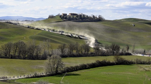 Competitors pedal during the Strade Bianche (White Roads) cycling race, near Siena, Italy, Saturday, March 6, 2021. (Fabio Ferrari/LaPresse via AP)