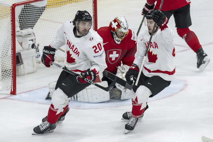 Canada&#039;s Nick Paul, left, and Canada?s Andrew Mangiapane, right, celebrate after their goal against Switzerland goalkeeper Leonardo Genoni, center, during the Ice Hockey World Championship group  ...