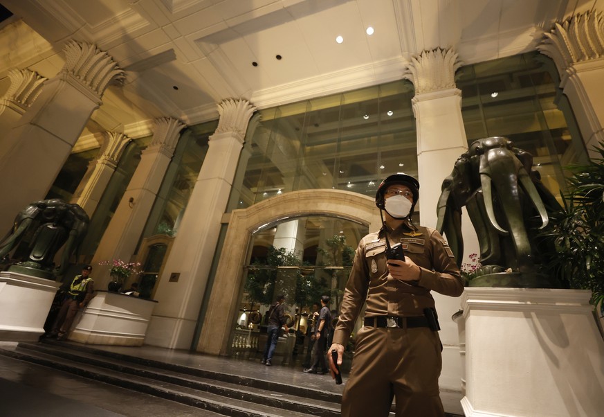 epa11482120 A Thai police officer secures the area during investigations after six people were found dead at the Grand Hyatt Erawan Hotel in Bangkok, Thailand, 16 July 2024. Police found six bodies, t ...