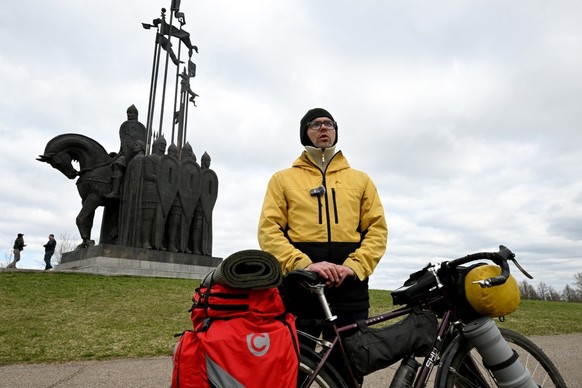 Dmitry Zhukov, the 37-year-old cycletourer, talks to AFP reporters in front of a monument to the Battle on the Ice, honouring the 1242 battle on the frozen Lake Peipus (Chudskoye) when Russian medieva ...
