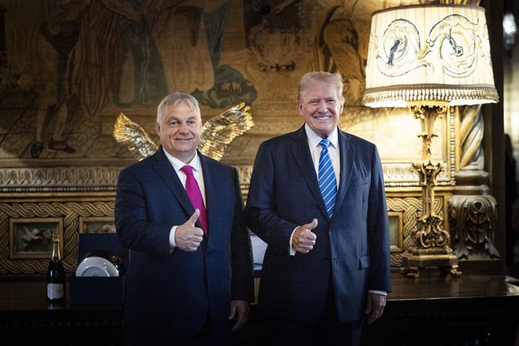 epa11473669 A handout photo made available bythe Hungarian PM?s Press Office shows Hungarian Prime Minister Viktor Orban (L) and former US president and Republican presidential candidate Donald Trump  ...