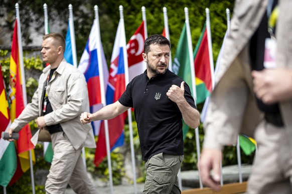 epa11415722 Ukrainian President Volodymyr Zelensky (C) on his way during bilateral talks at the Summit on Peace in Ukraine in Stansstad near Lucerne, Switzerland, 16 June 2024. International heads of  ...