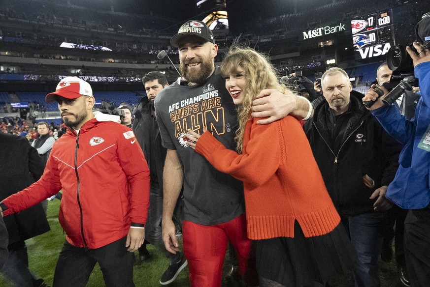 FILE - Kansas City Chiefs tight end Travis Kelce and Taylor Swift walk together after an AFC Championship NFL football game between the Chiefs and the Baltimore Ravens, Jan. 28, 2024, in Baltimore.. T ...