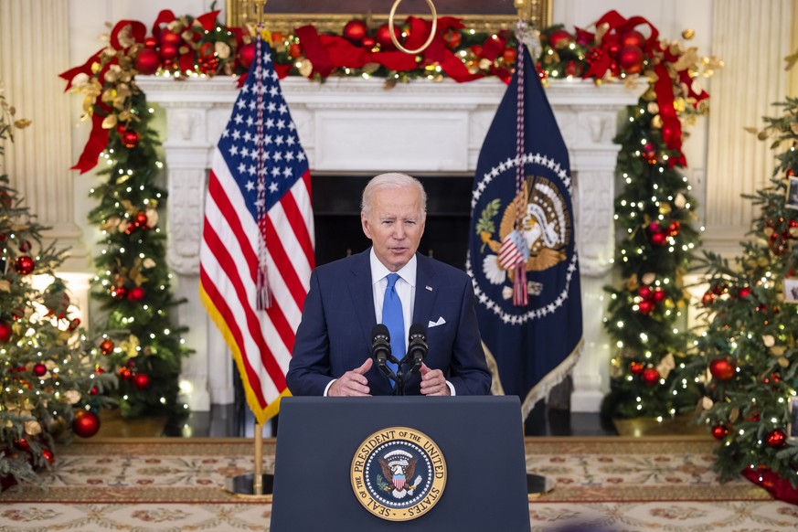 epa09653007 US President Joe Biden speaks on the Covid pandemic in the State Dining Room of the White House in Washington, DC, USA, 21 December 2021. Biden said he plans to distribute 500 million free ...