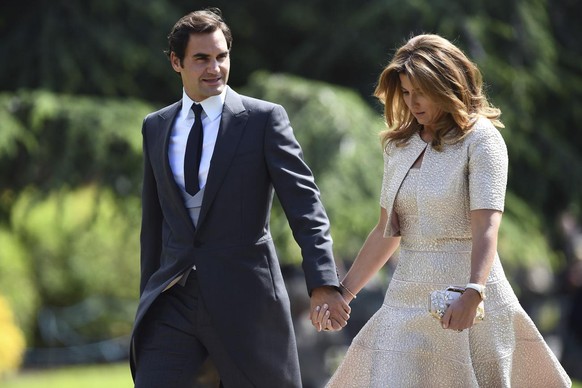 Swiss tennis player Roger Federer, left and his wife Mirka arrive for the wedding of Pippa Middleton and James Matthews at St Mark��&amp;#x2122;s Church in Englefield, England, Saturday, May 20, 2017. ...