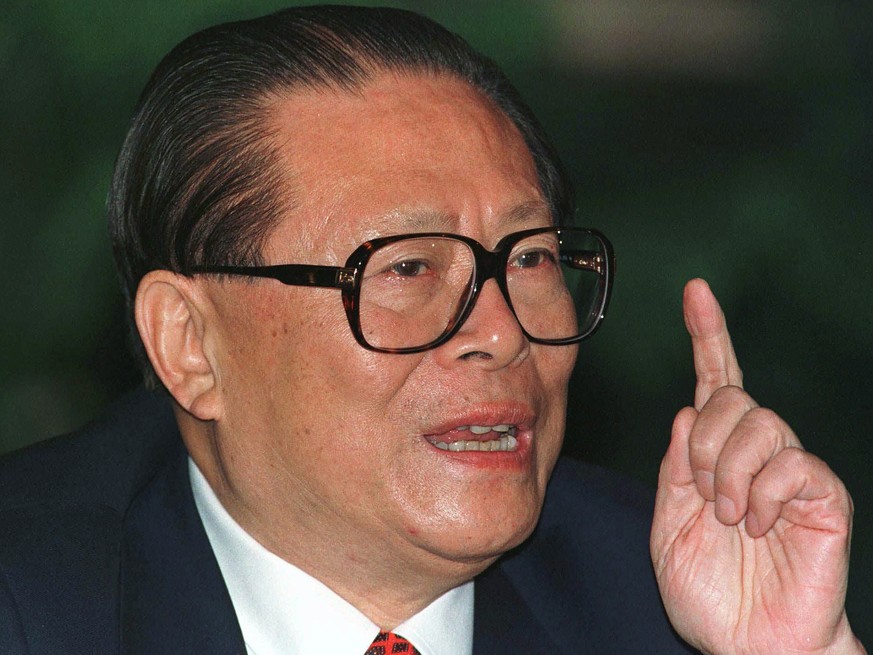 FILE - Chinese then President Jiang Zemin makes a point during a press conference in Beijing, one day before his departure for an eight-day visit to the U.S, Oct. 25, 1997. Jiang has died in Shanghai ...