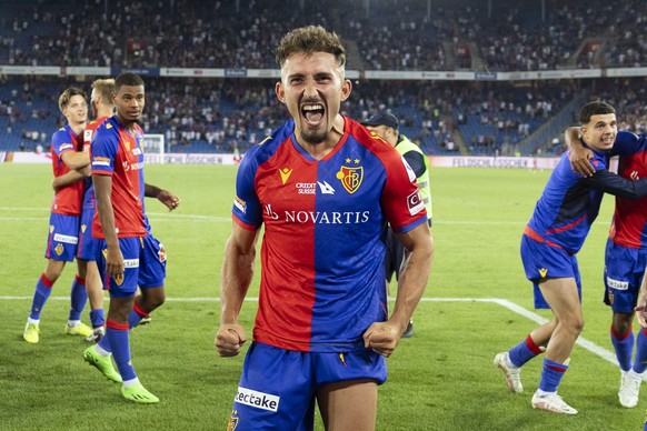 Basel&#039;s Andi Zeqiri, front, and his teammates celebrate after winning the penalty shootout during the UEFA Europa Conference League third qualifying round, second leg soccer match between FC Base ...