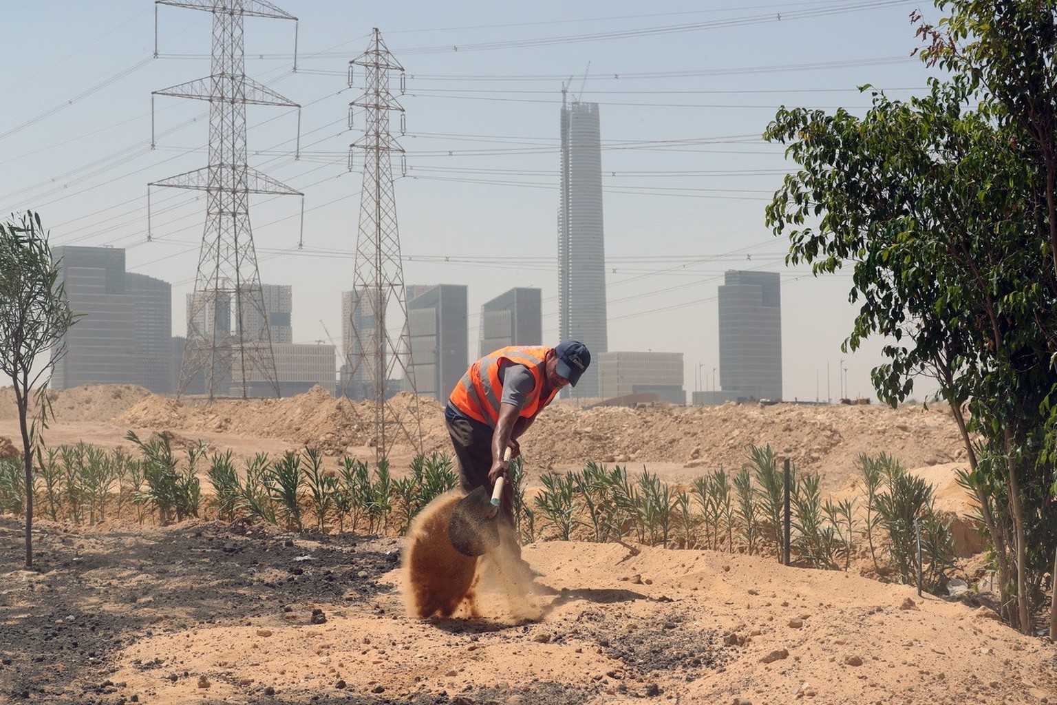 epa10180140 Workers at a construction site of the New Administrative Capital (NAC), some 45km east of Cairo, Egypt, 12 September 2022. The new city is located 45 kilometers east of Cairo, in an area h ...