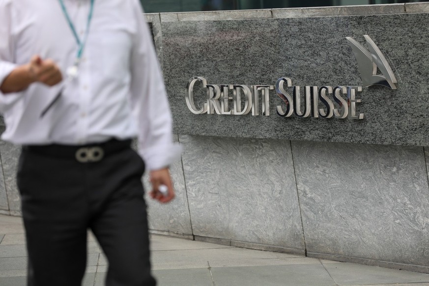 epa10536139 A man walks past the logo of Credit Suisse in Hong Kong, China, 22 March 2023. The Hong Kong Monetary Authority said Credit Suisse