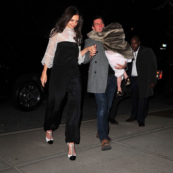 NEW YORK, NY - DECEMBER 18: Katie Holmes, Tom Cruise and Suri Cruise seen on the streets of Manhattan after celebrating Katie&#039;s birthday at Buddakan on December 18, 2011 in New York City. (Photo  ...