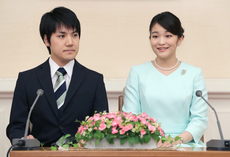 epa09499113 (FILE) - Japanese Princess Mako (R) and her boyfriend Kei Komuro attend a press conference in Tokyo, Japan, 03 September 2017 (issued 01 October 2021). On 01 October 2021, the Imperial Hou ...